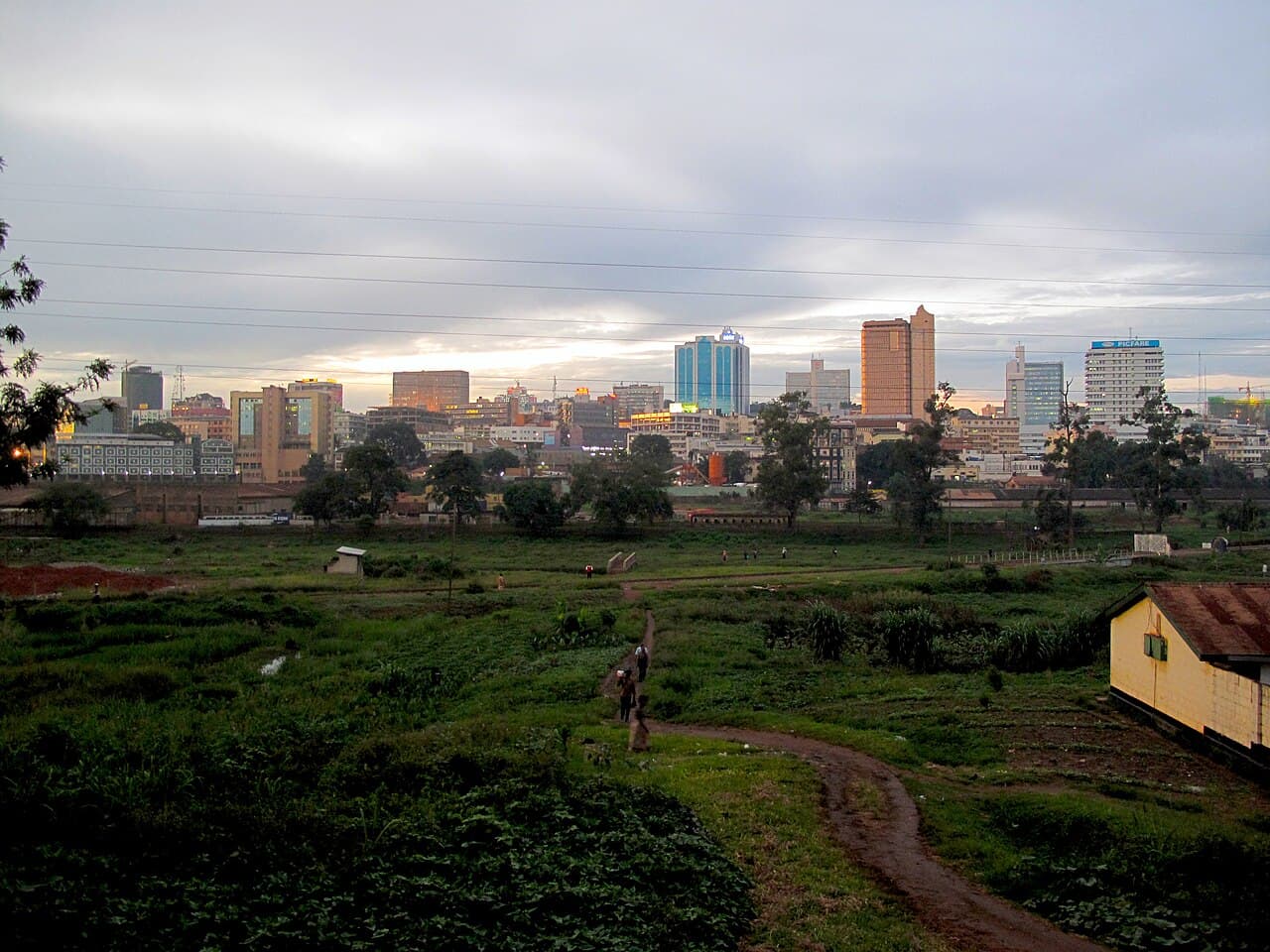 The Kampala skyline seen across a railway yard