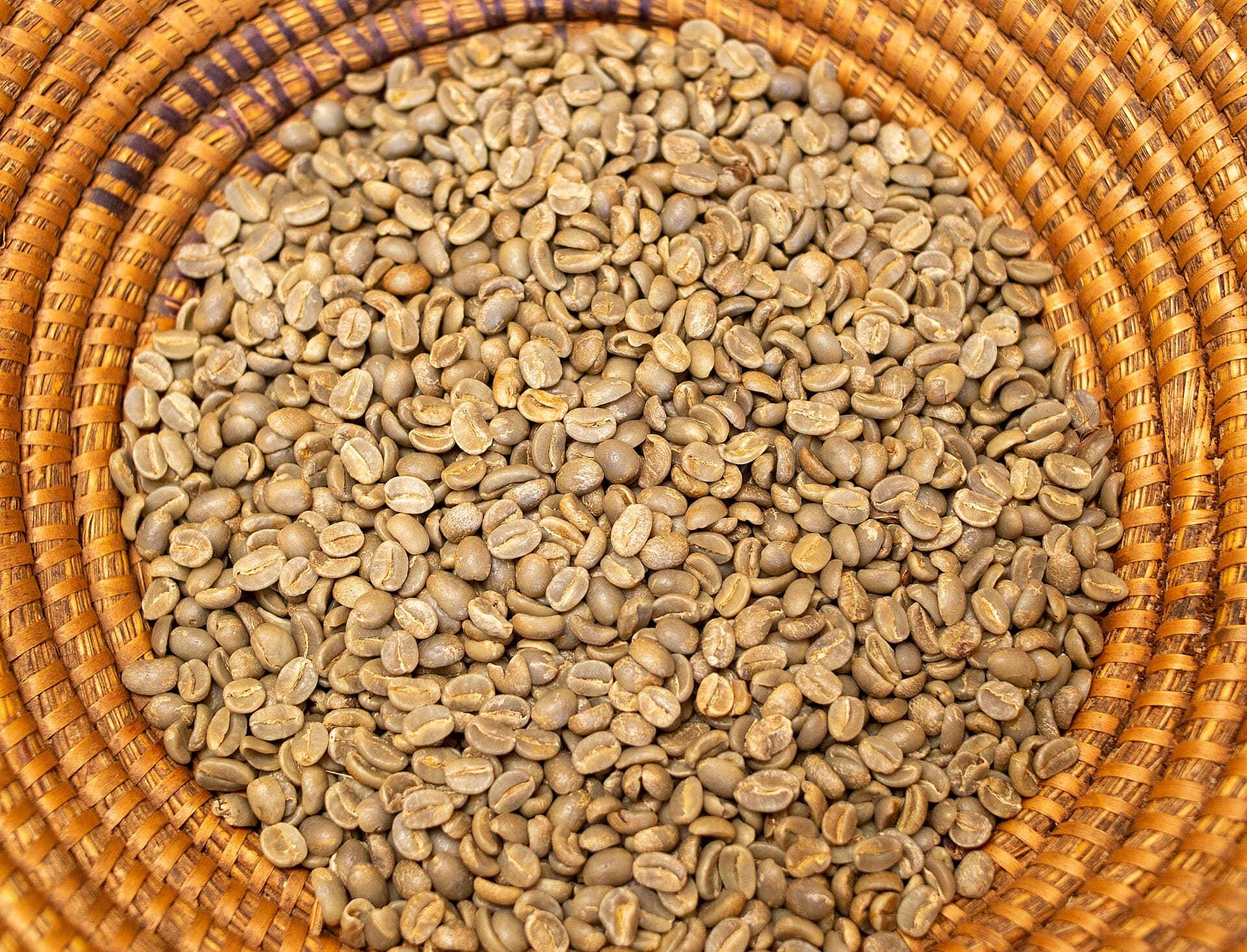 Dried coffee beans in a locally woven basket