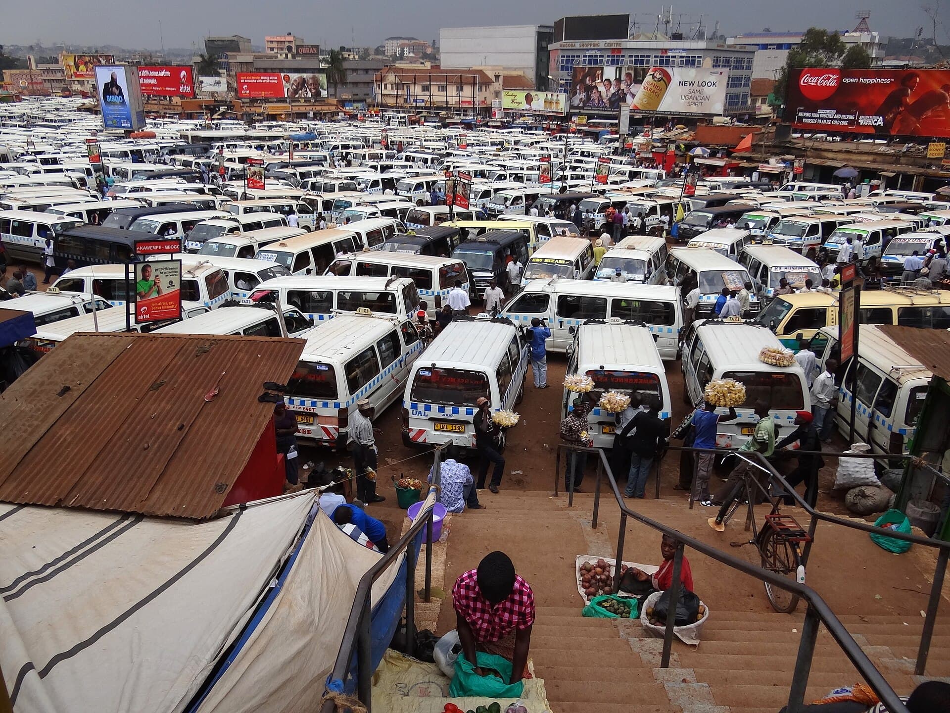 Rows of minibus taxis in a downtown Kampala taxi park
